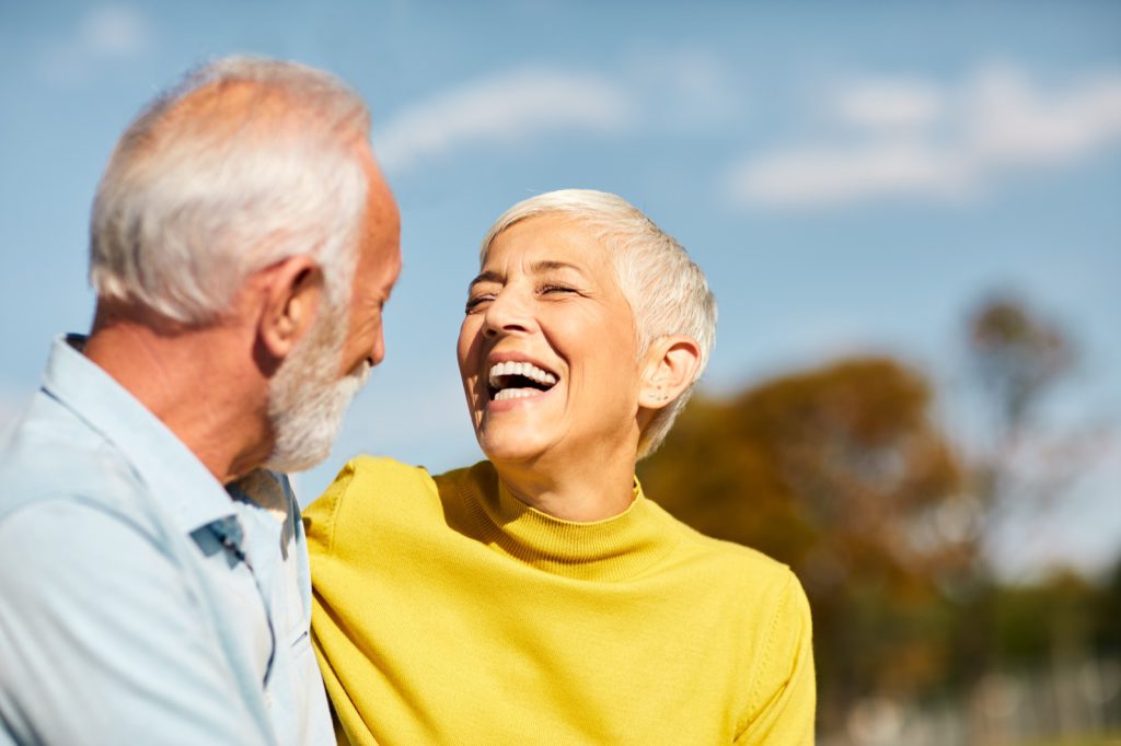 portrait of happy smiling senior couple outdoors